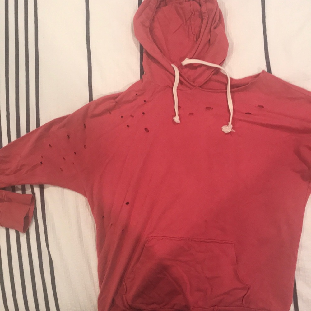 Cute red top with some trendy rips